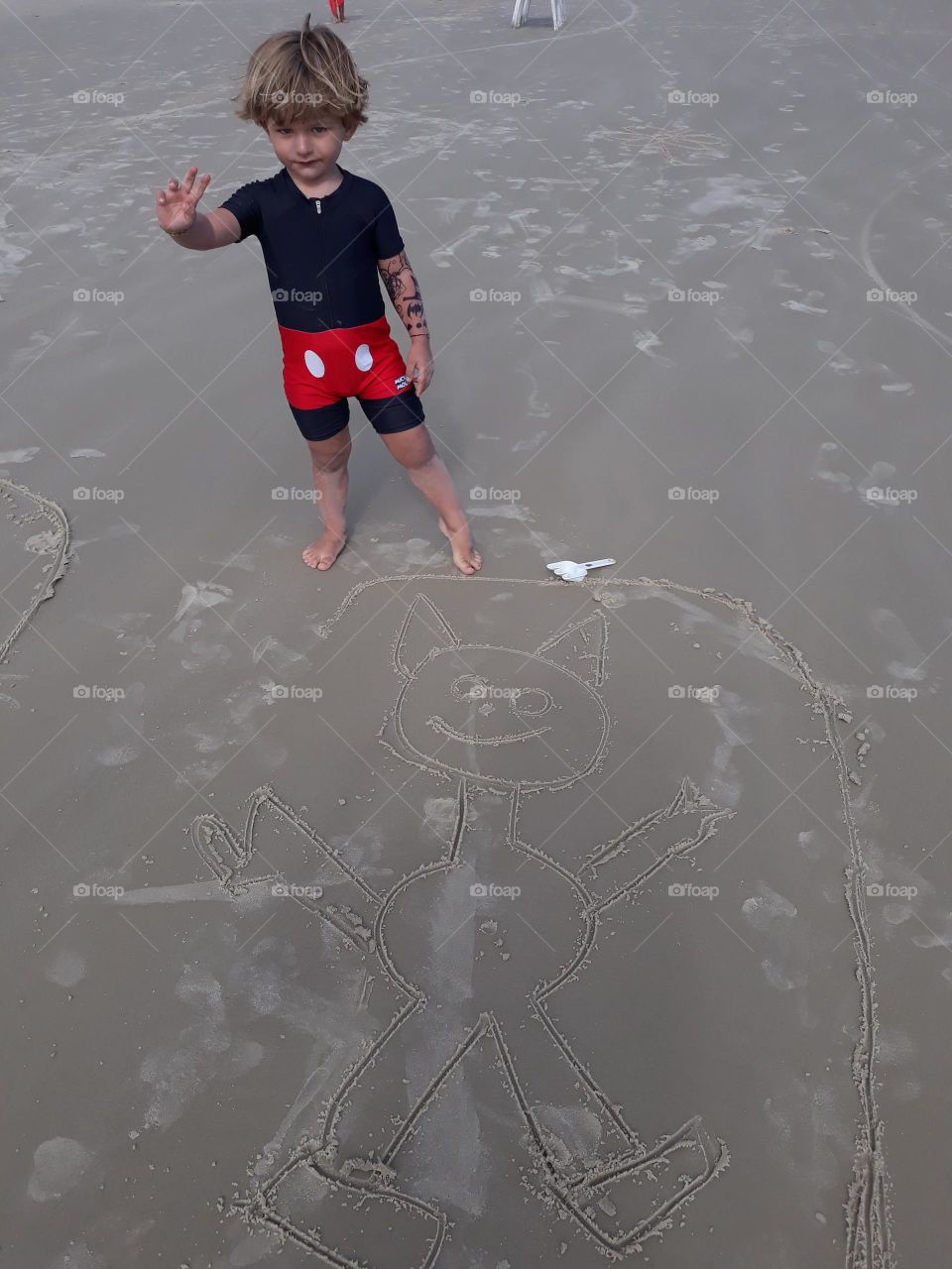 child taking a walk by the sea