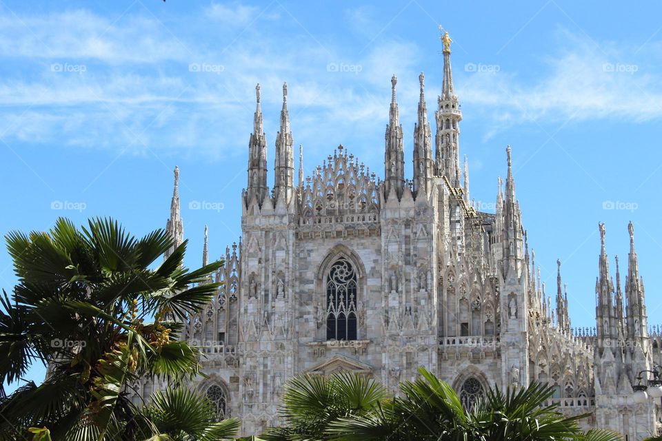 View of the Cathedral Duomo di Milano in the central square of Milan, Italy.  Gothic architecture