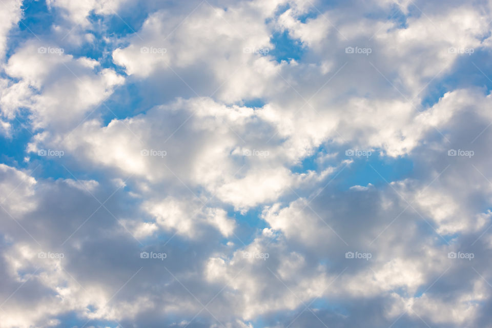 The beauty of the sky with clouds and the sun.