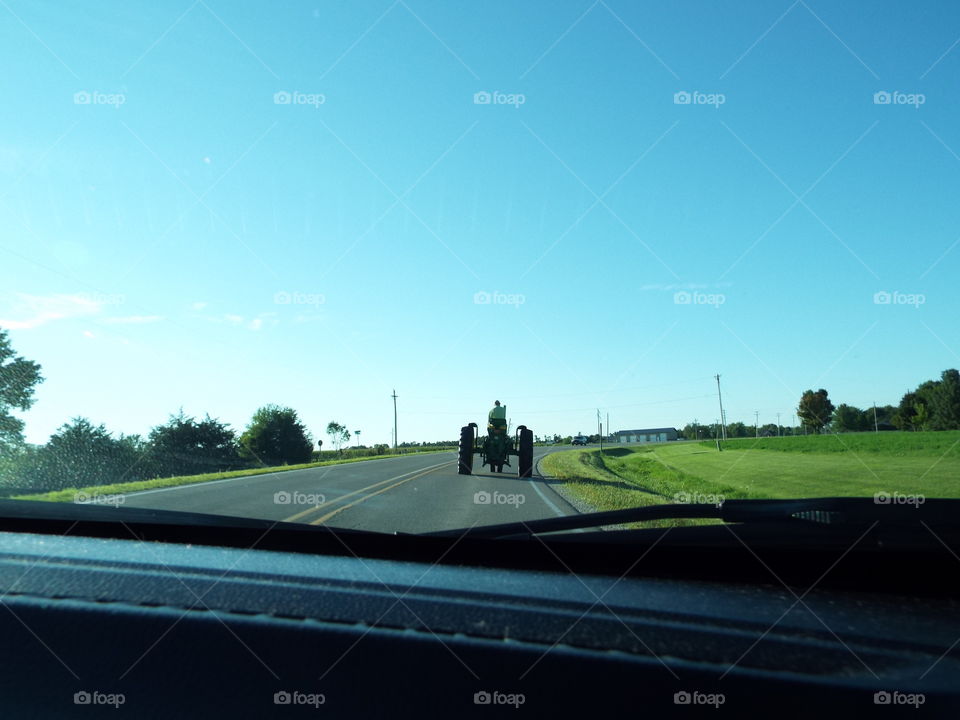 tractor driving down the road