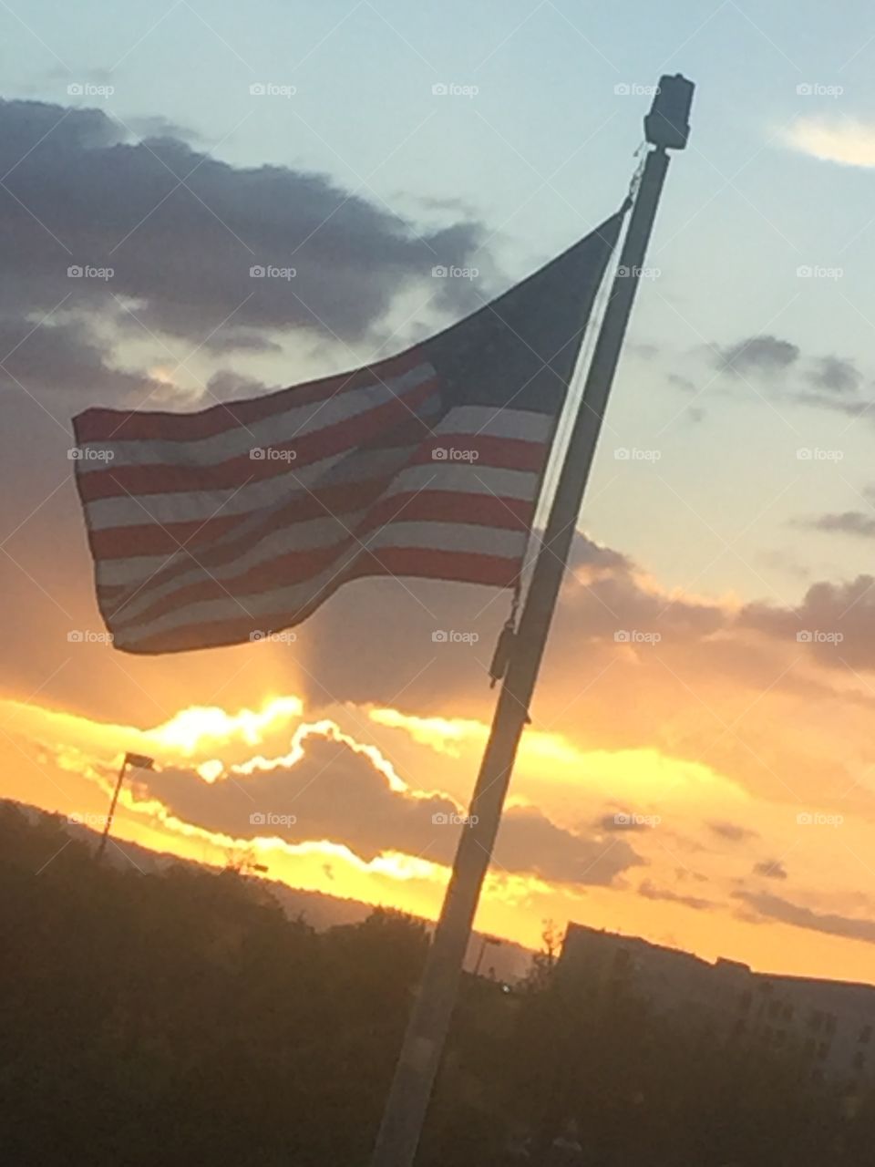 American flag against the sunset