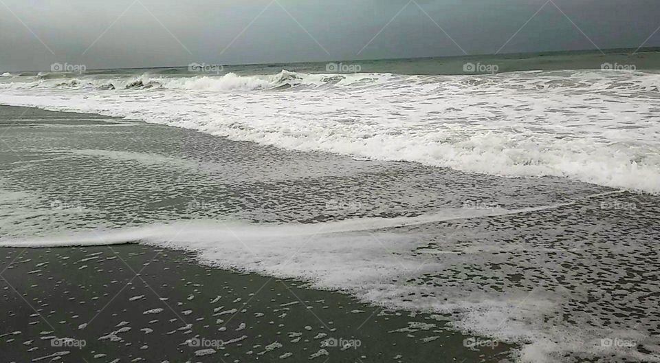 Stormy day on the beach off the gulf coast in Florida had some choppy waters and pretty waves.