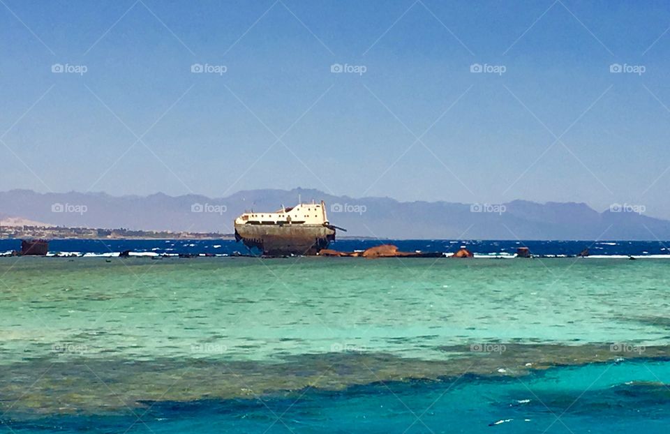 A Wrecked ship on coral reef 