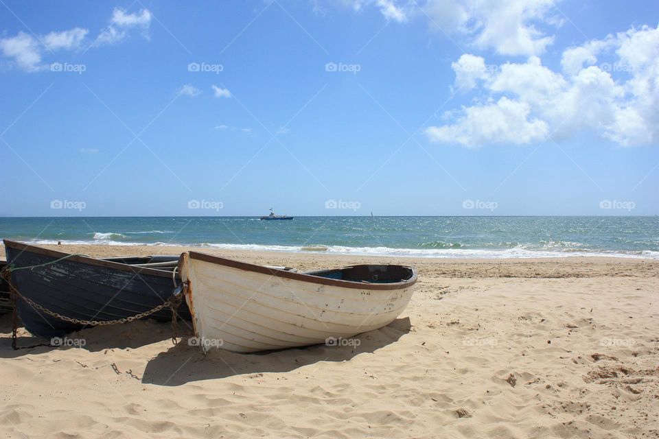 Boat on the beach in a sunny day