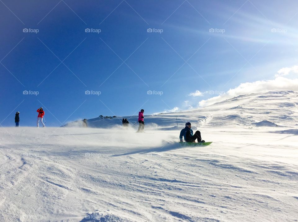 Skiers skiing in snow
