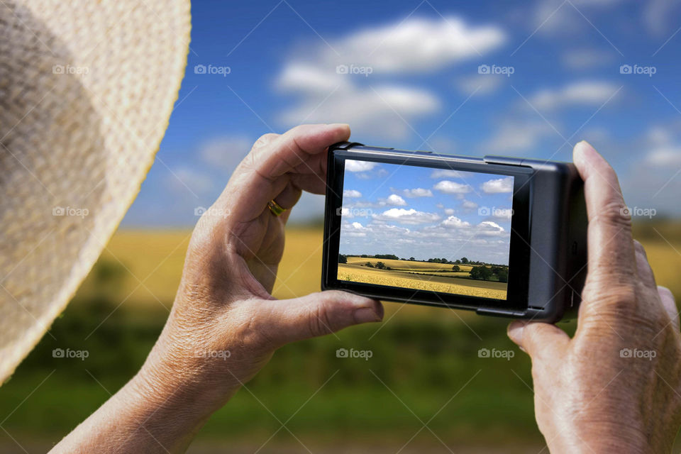 Phone. Camera phoneTourist taking a picture with a smartphone cell phone mobile phone camera 