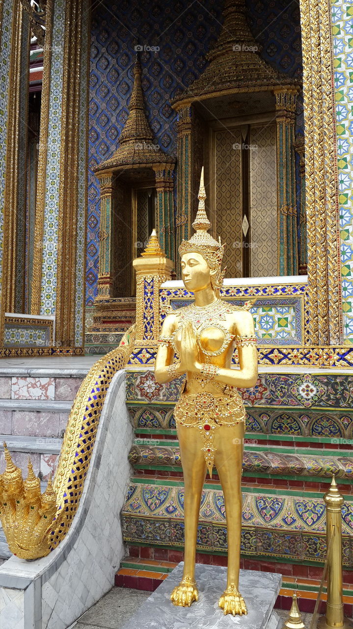 golden kinnaree statue