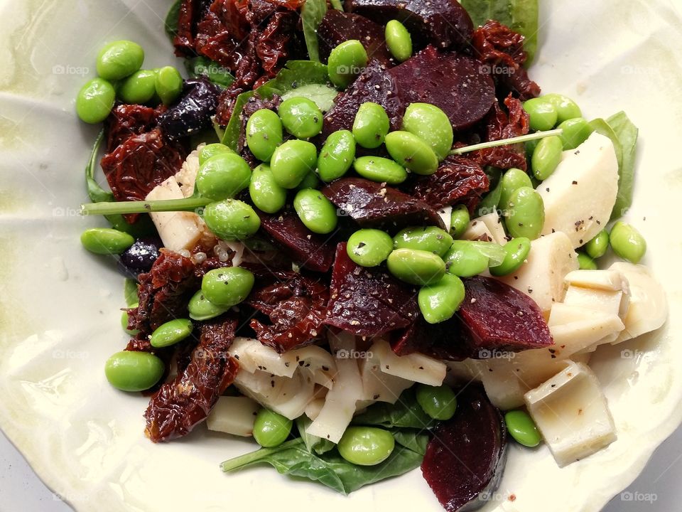 Spinach and Edamame Salad with beets sun dried tomato hearts of Palm olives and quinoa