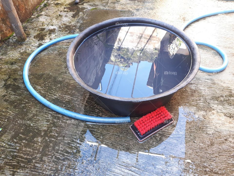 round bucket filled with water for washing