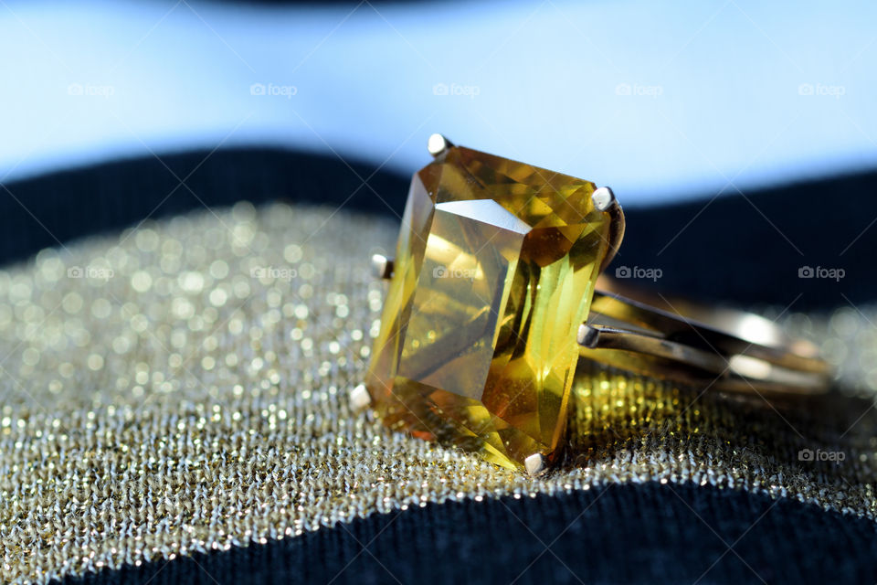 Close-up of yellow gemstone ring