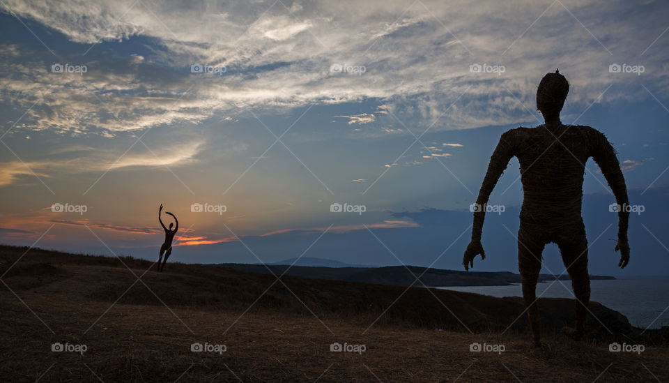 Tall hay figures outdoors