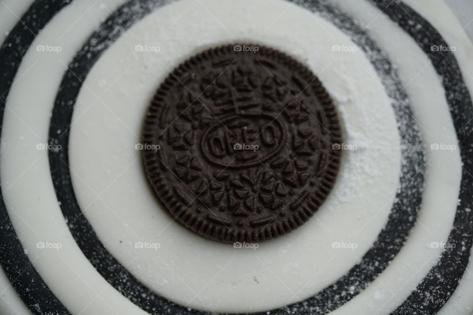 Oreo Biscuit surrounded by black and white fondant icing .. cake topper
