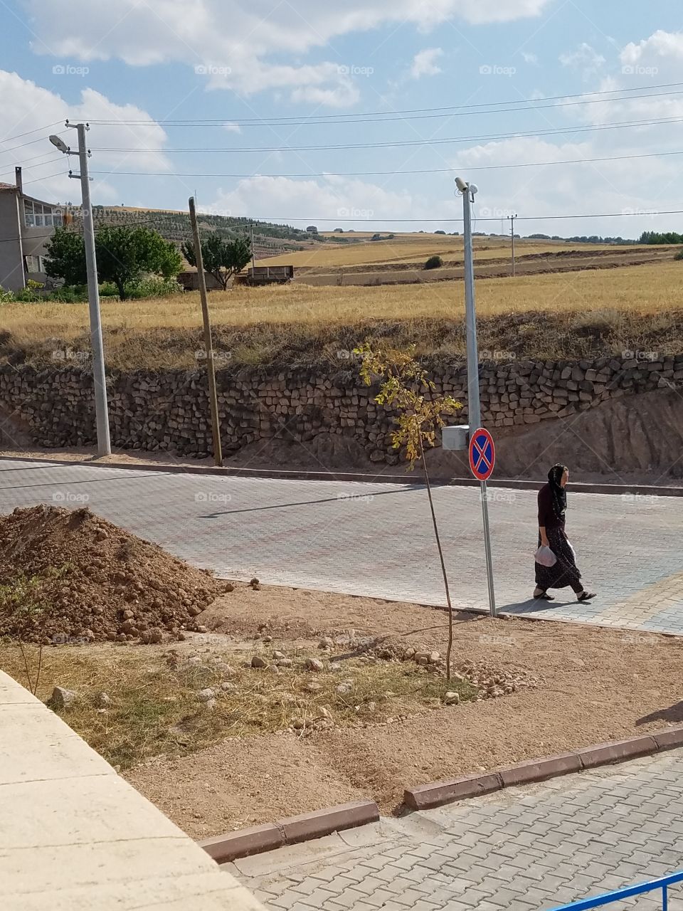 an old woman walks the streets in Cappadocia Turkey