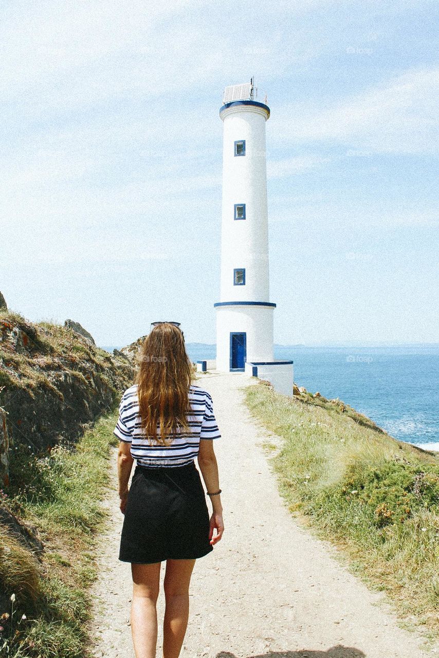 a woman and the lighthouse