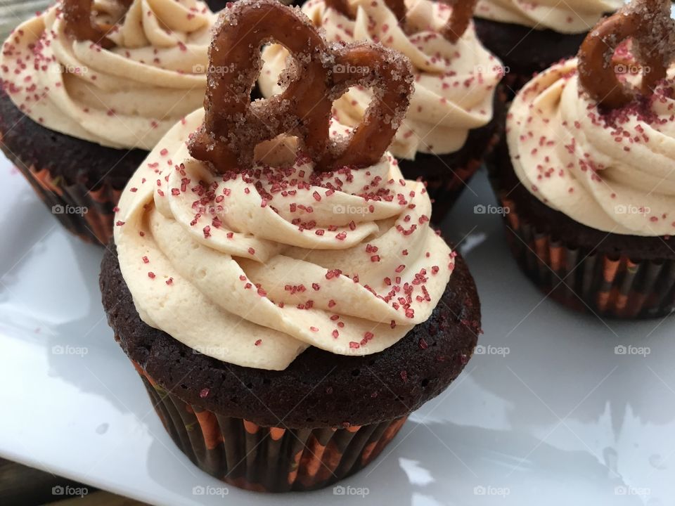 Milk Chocolate Cupcake with Caramel Buttercream with Cinnamon Sugar Pretzel 