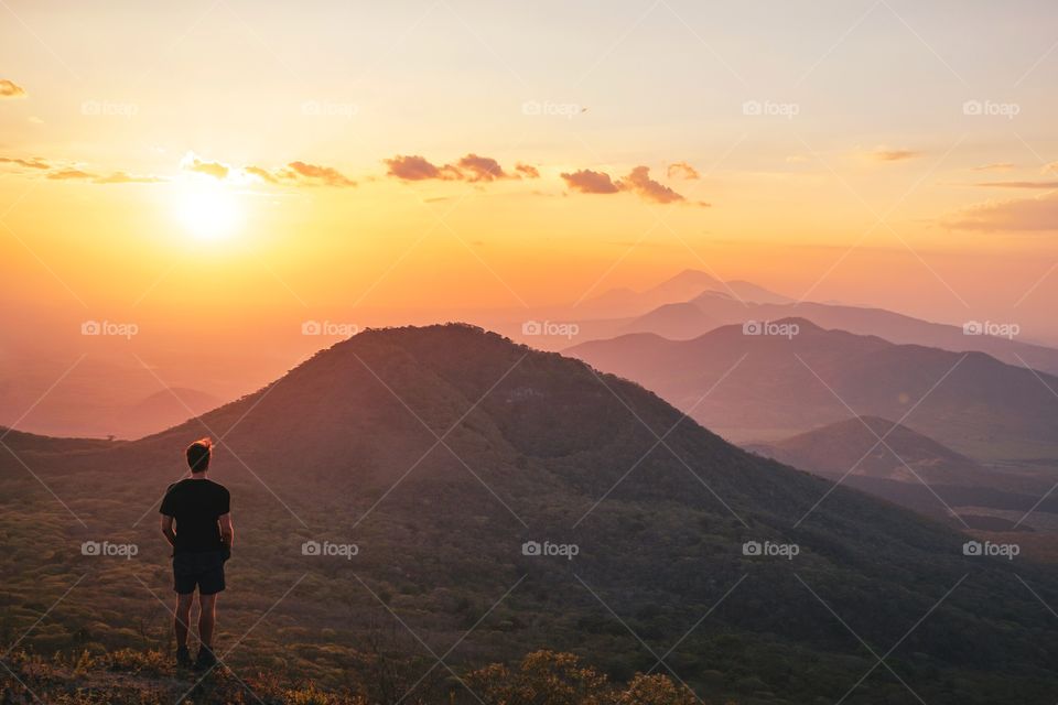 Enjoying a beautiful sunset after a long and tiring hike