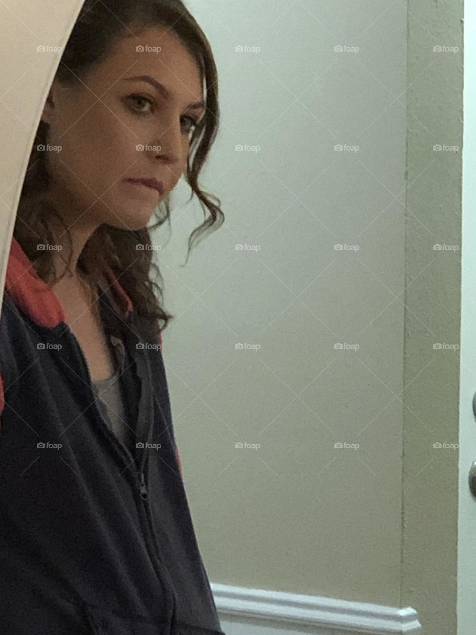 Bride-To-Be catches a pensive peak at the aisle she will soon walk down