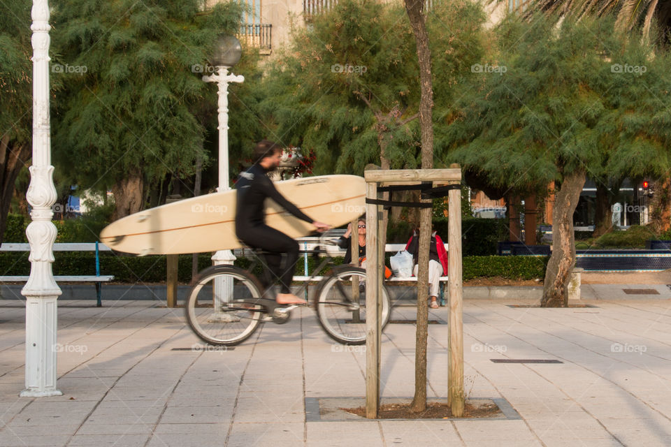 Biker and a surfer. San Sebastián 