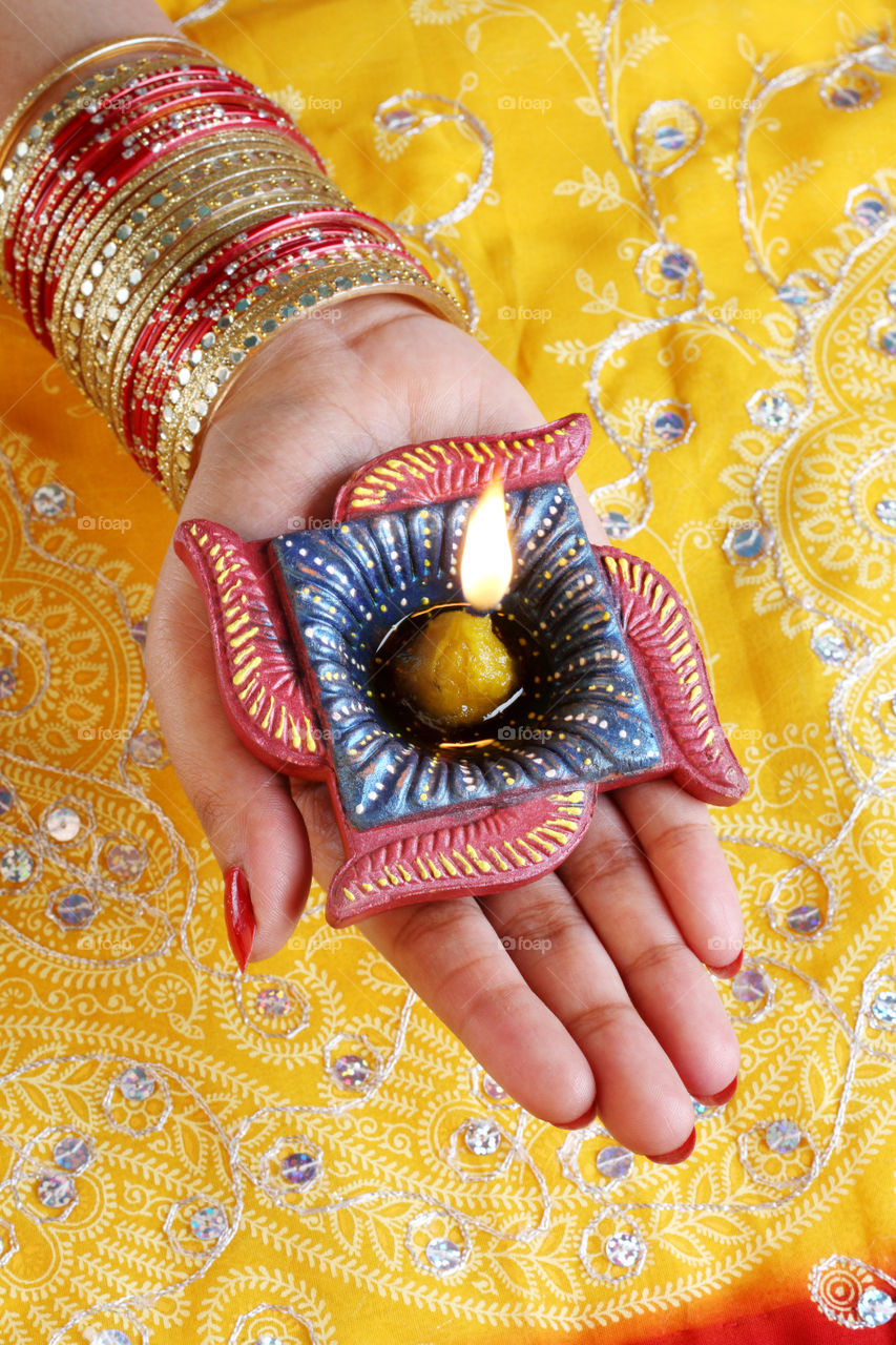 Diwali diya in a female hand