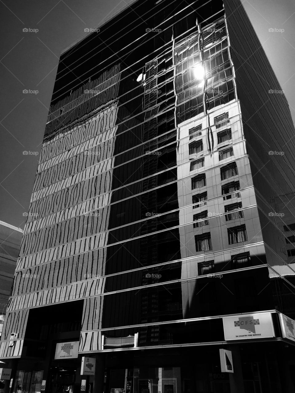 Grenfell Building. Grenfell St building wiyh mirrored glass refkecting buildings across the street. Adelaide South Australia 