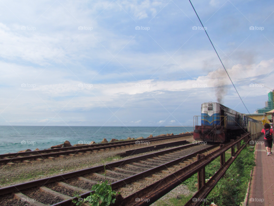 ocean sky clouds train by jadeh