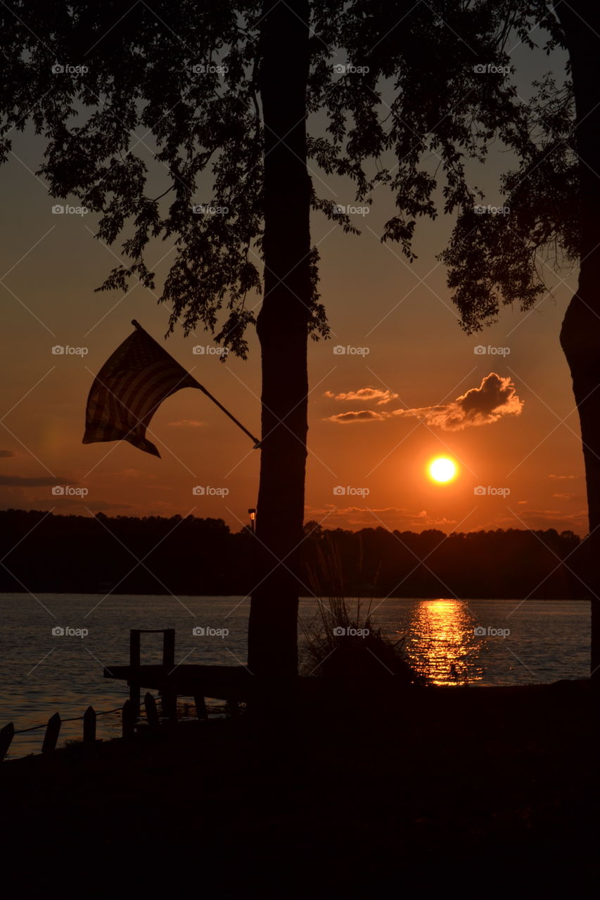 American Flag at Sunset. American flag flying at sunset on Logan Martin Lake in Alabama