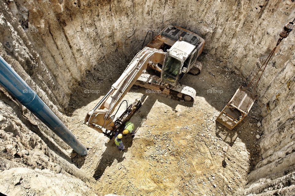 Deep excavation digging . Excavators digging micro tunnels in Doha Qatar 