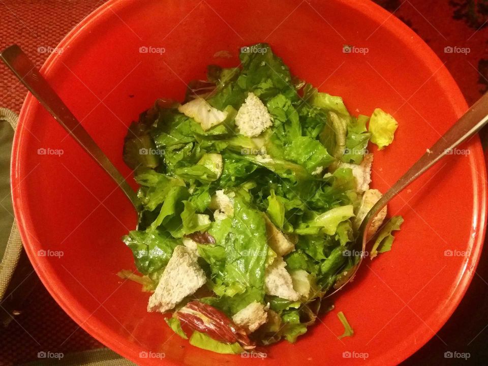 green salad in a red bowl