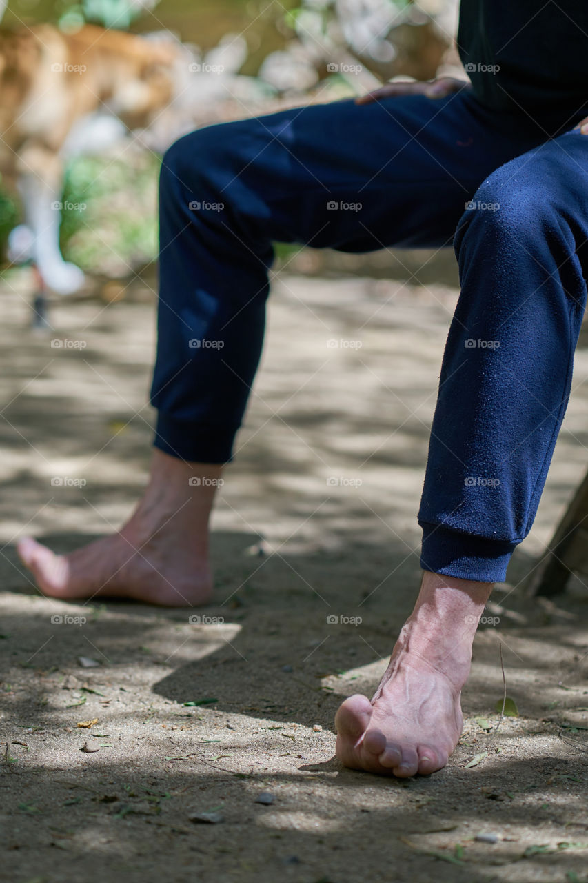 Low section of person doing yoga