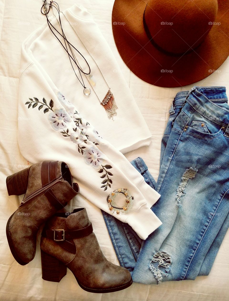 flat lay clothes jeans shirt hat boots