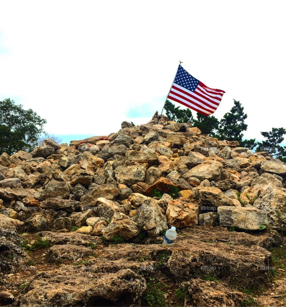American flag at the top of the Old Baldy trail at Garner state park 
