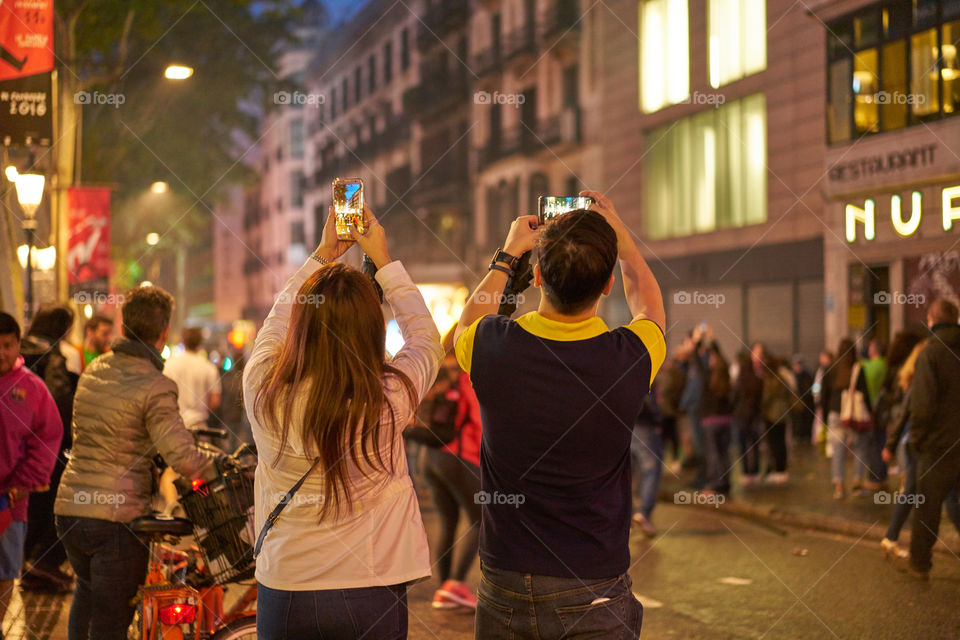 Tourists photographing the celebration 
