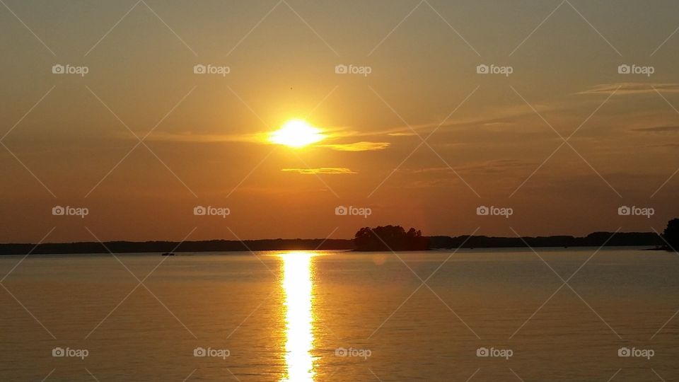 Beautiful, golden sunset over Lake Hartwell. Taken from the South Carolina side.