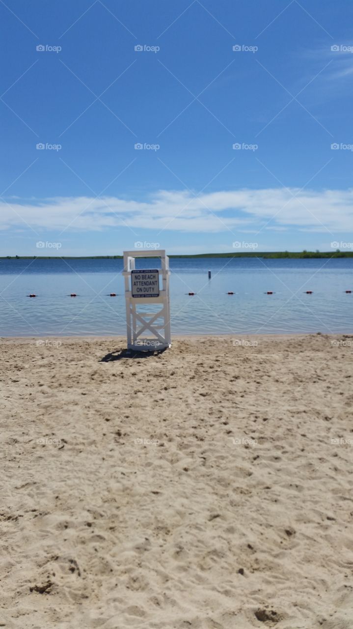 Vacant lifeguard chair on swim beach at Aurora Reservoir in Colorado