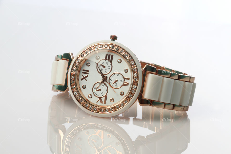 modern bling watch on white background with reflection