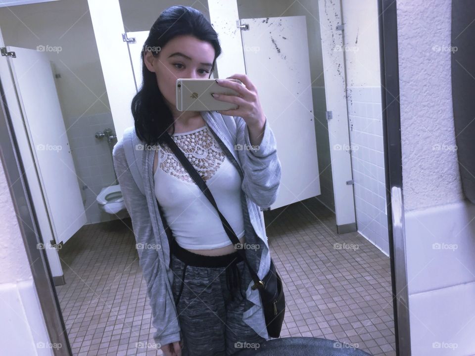 Woman taking selfie in mobile phone