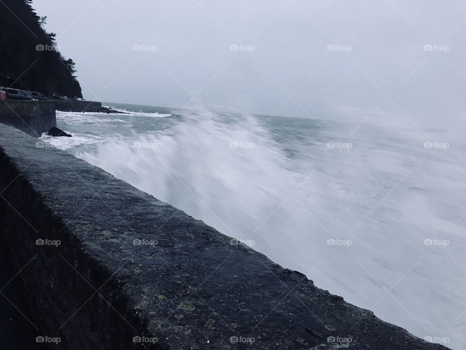 Capturing the roar of the sea against the sea wall.