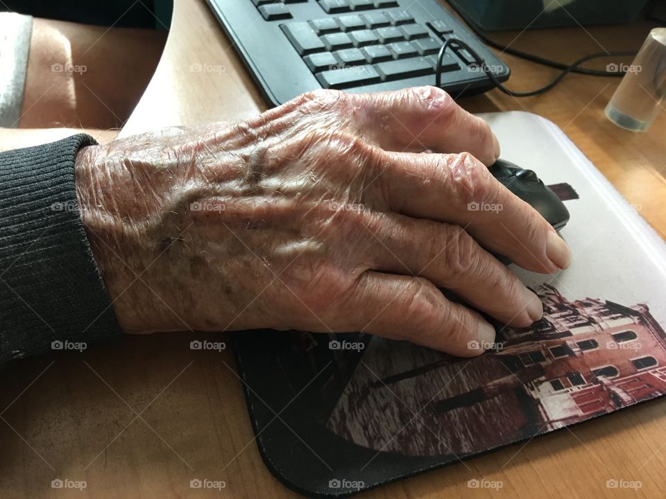 Man's hand on computer mouse 