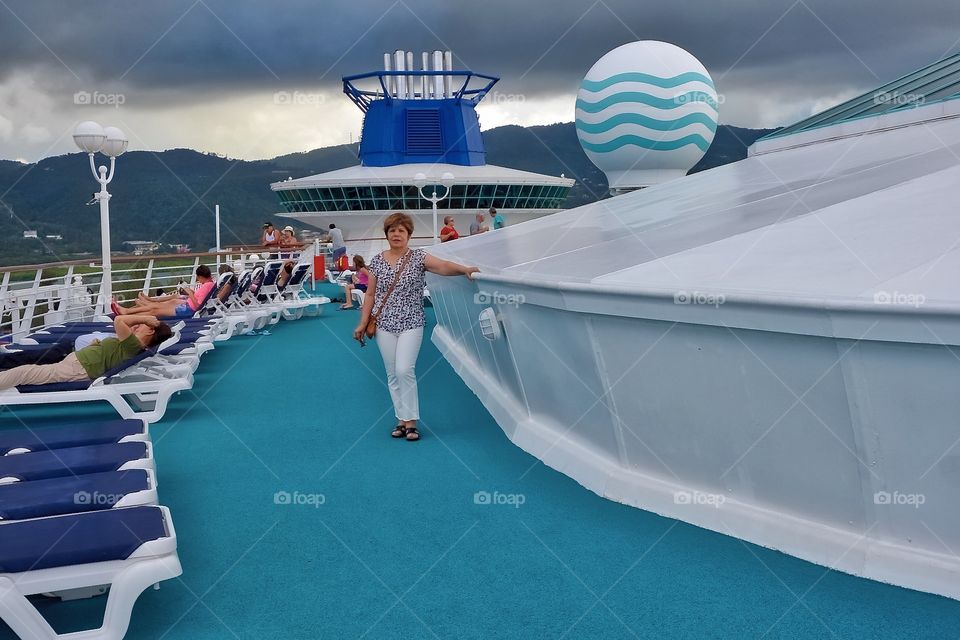 Woman standing near the lawn chair