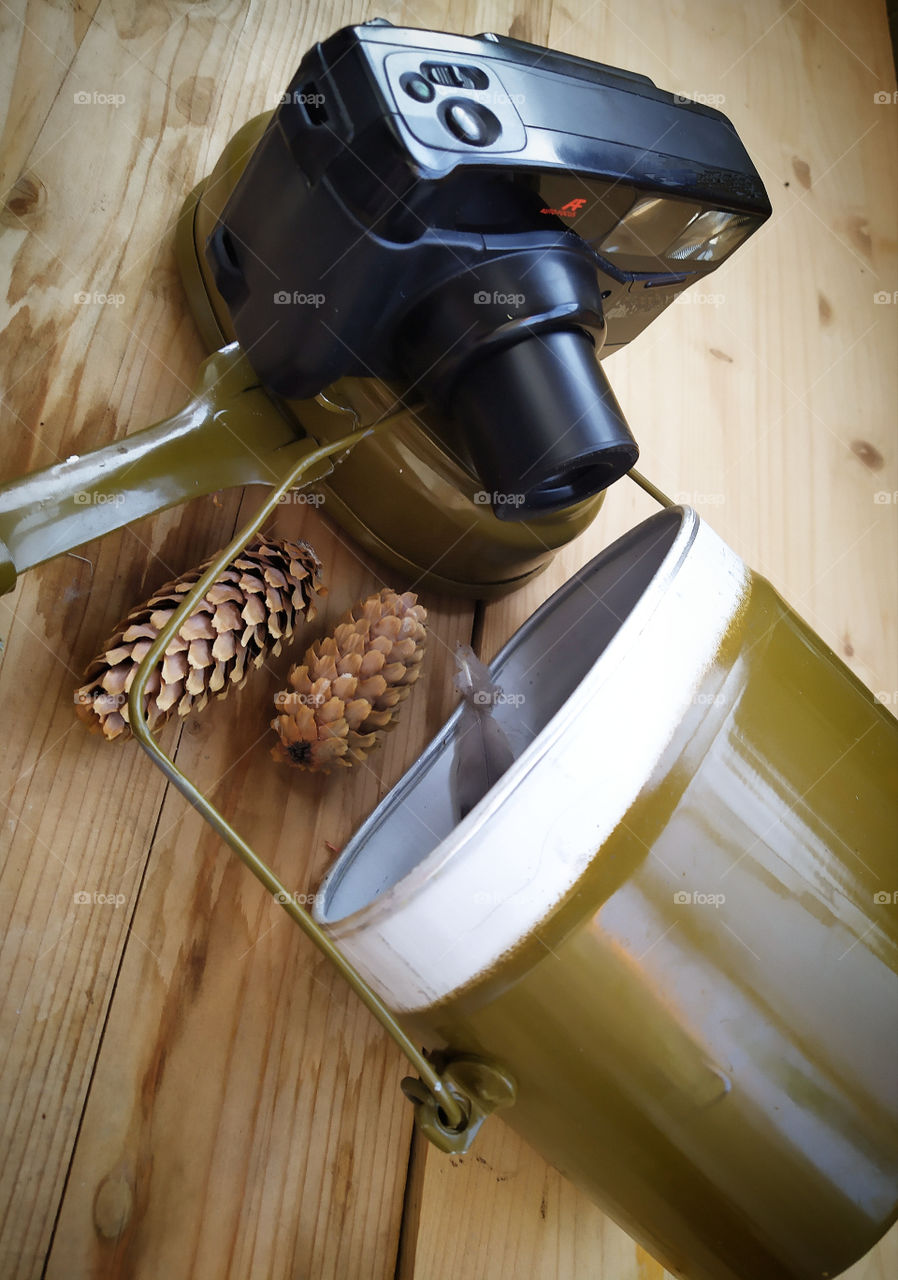 Camera.  Tourist cauldron and fir cones