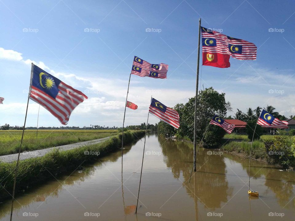 Patriotic. Malaysia flag at the river