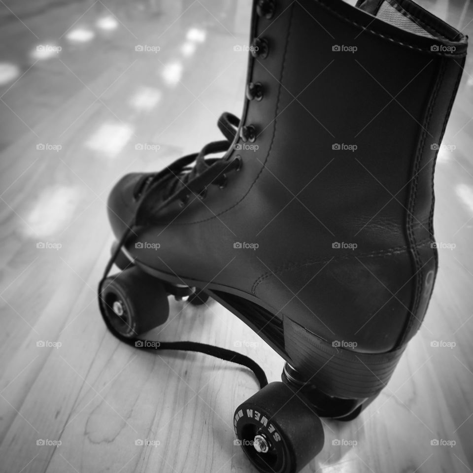 Black and white photo of a roller skate