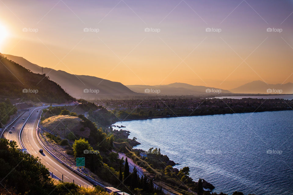 sunset sea and highway all in the horizon