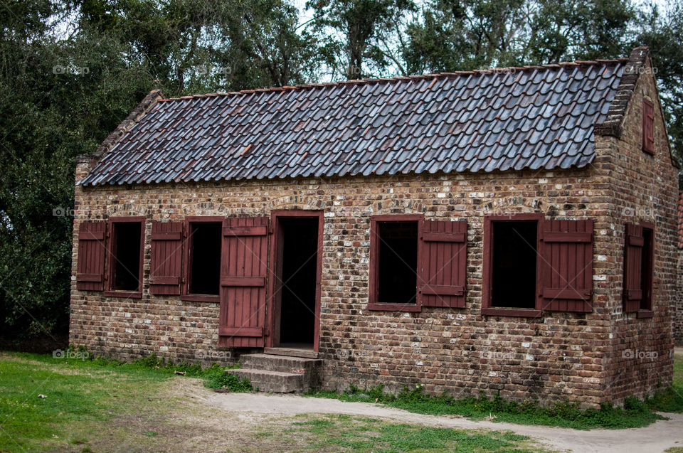 Old house with open windows and door
