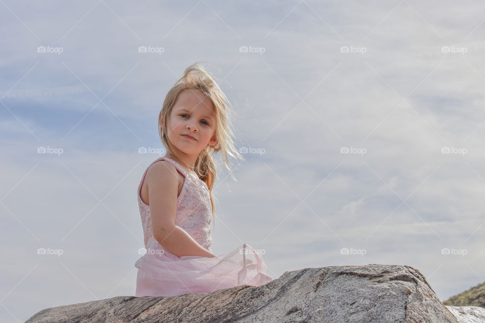 young kid on rock