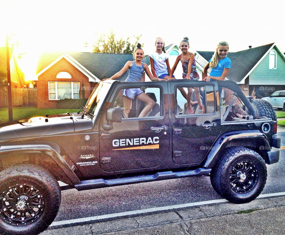 Happy girls JEEP sunset