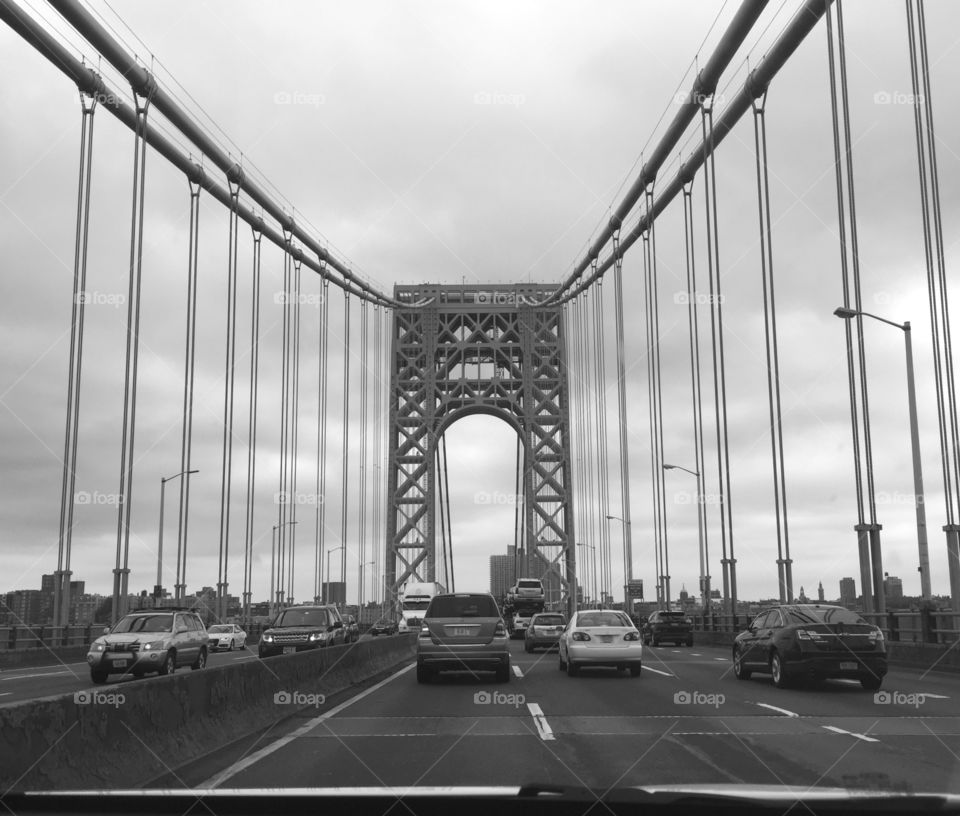 View from behind on a bridge over the river! Cars creeping along in the traffic!