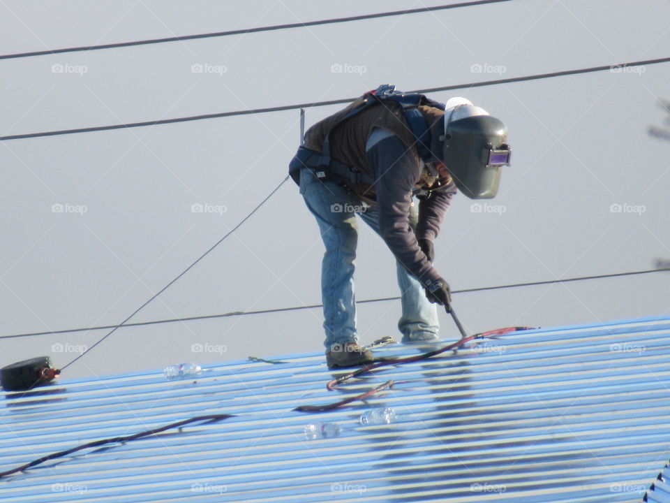 Working on a metal roof