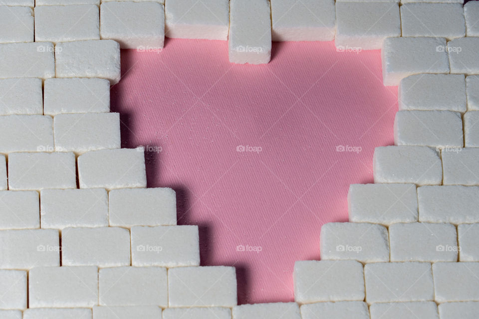 Sugar cubes in heart shape. Creative valentine concept