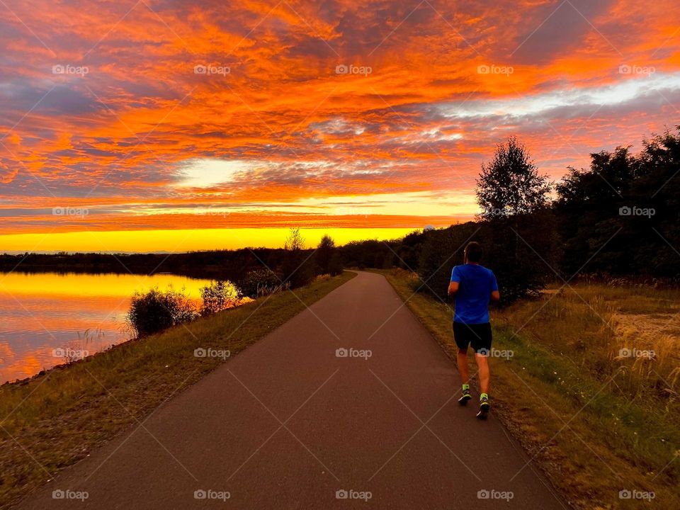 Running in beautiful Sunset at the lake 